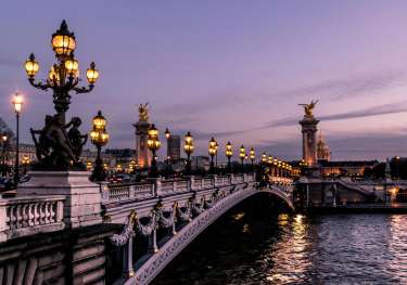 Paris bridge in the evening.